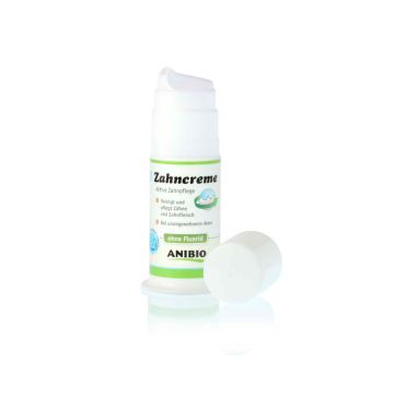 Envase dispensador de crema dental para perros ANIBIO, de color blanco y con detalles verdes.